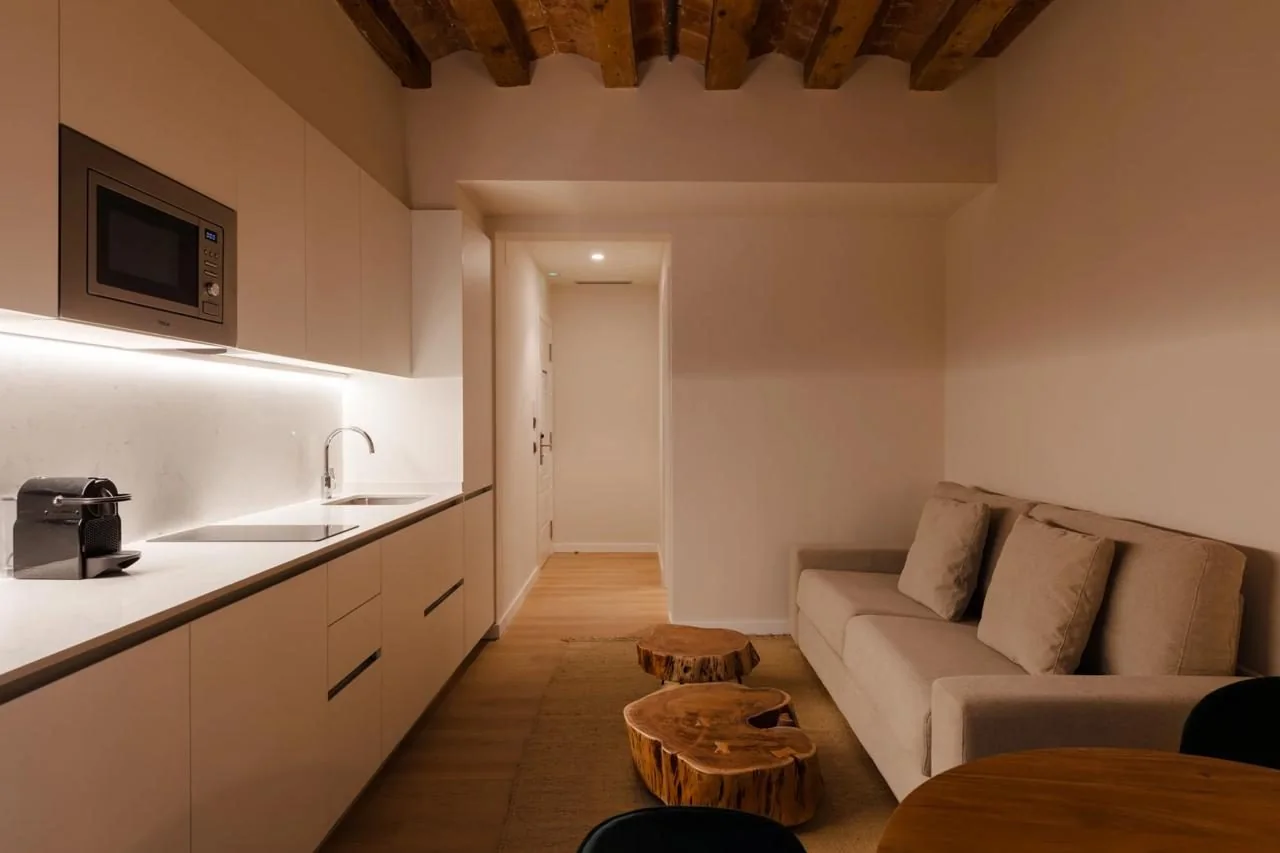 Studio kitchen with sink and cupboards