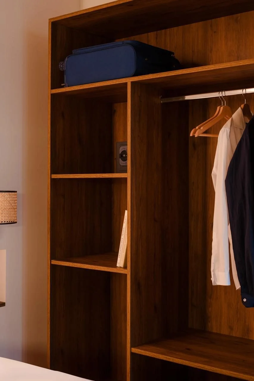 Open wardrobe and entrance to the room